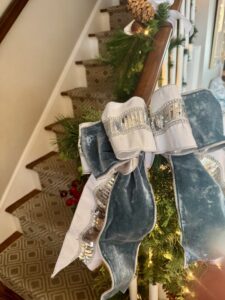 Elegant holiday staircase garland with ribbon and ornaments in Westchester NY
