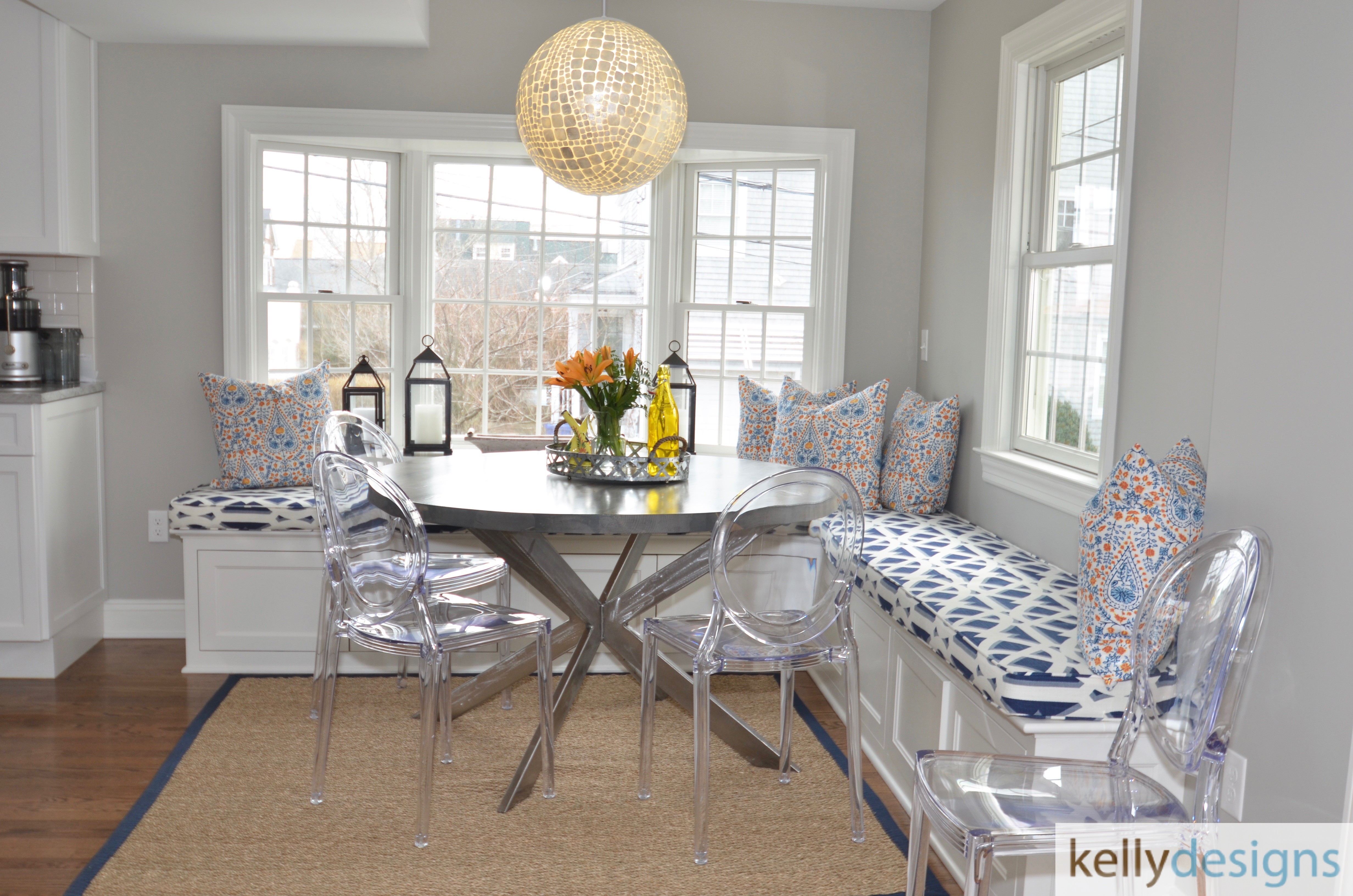 We added this cozy banquette with some bright colors from John Robshaw to make this kitchen nook a family favorite.
