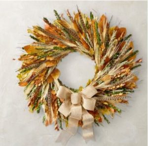 Maple leaves, wheat, feathers with a burlap ribbon from Williams Sonoma